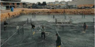 Why Sustainable Housing Is Moving Faster in Modular Than in Traditional Construction Workers at a Construction Site